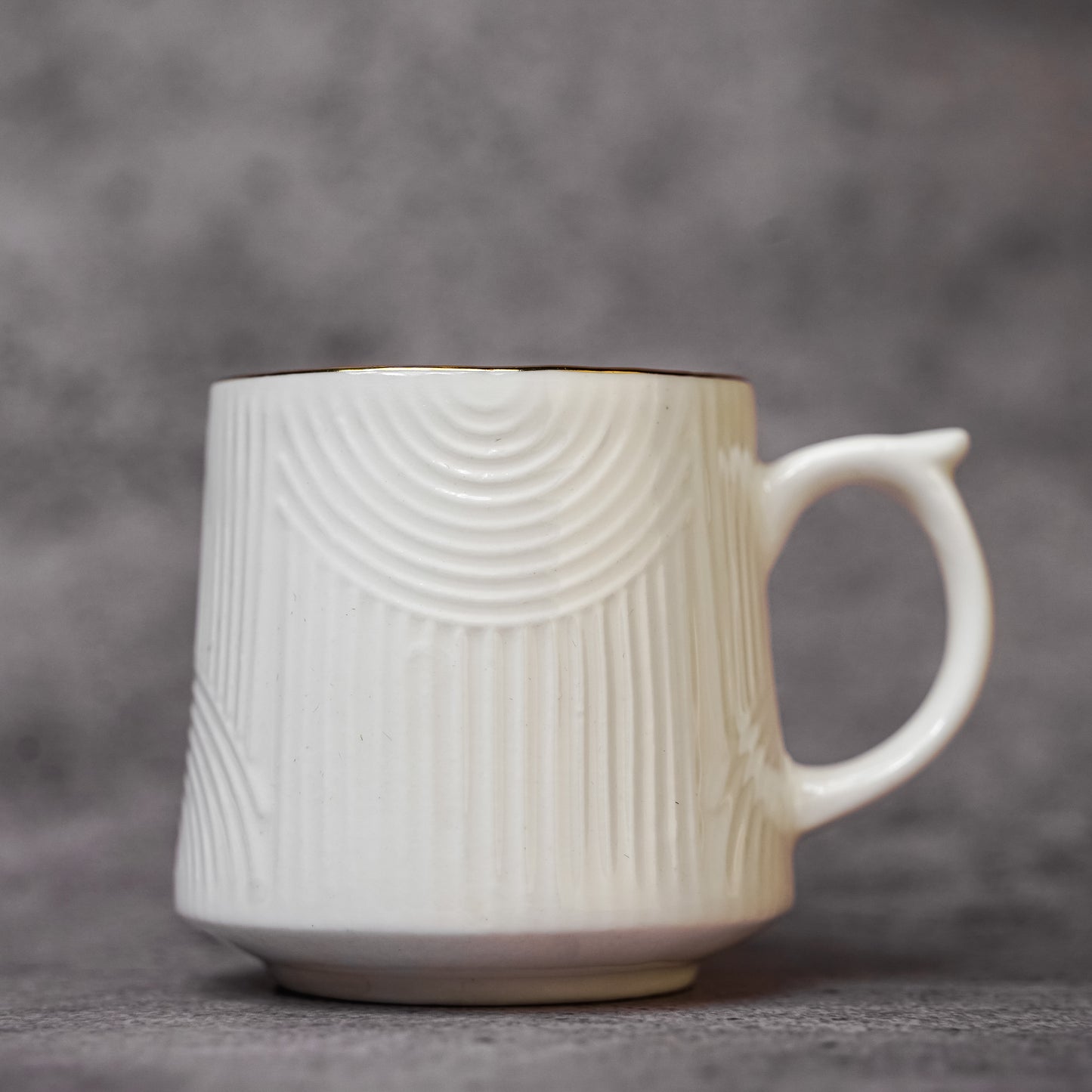 Textured White Teacup with Gold Rim - Modern Ceramic Design