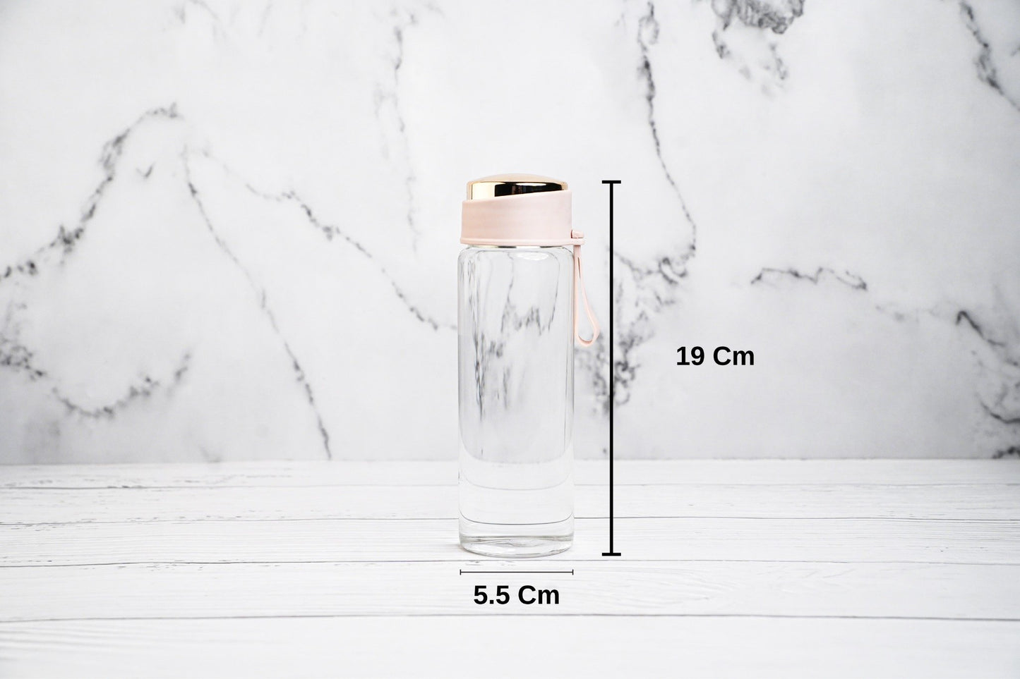 Glass water bottle with pink cap, eco-friendly and reusable
