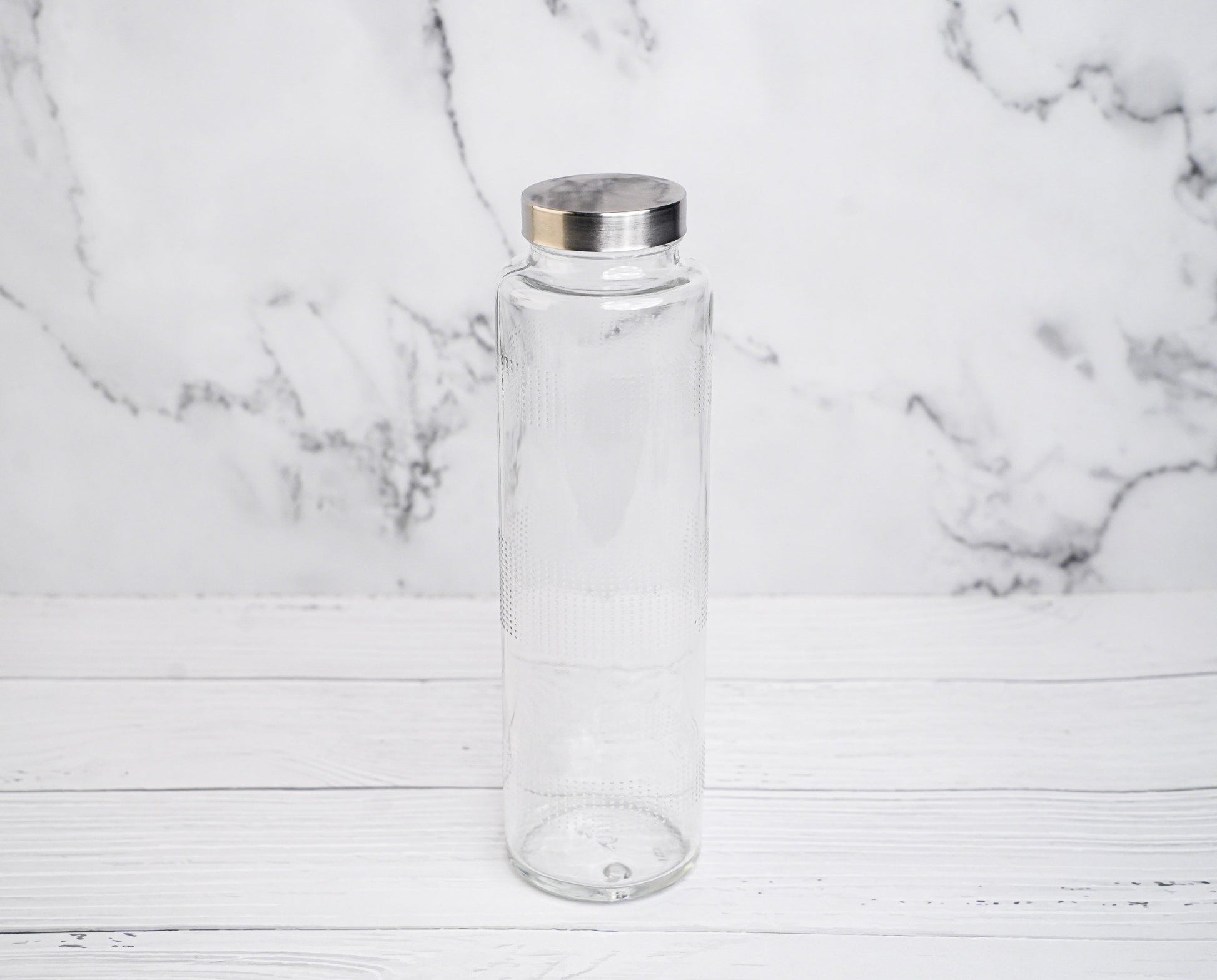 Glass water bottle with metal cap, eco-friendly and reusable for everyday hydration
